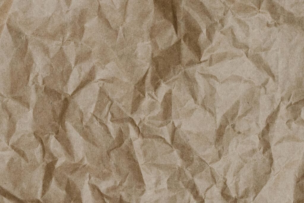Abstract texture of crumpled craft paper, ideal for design and background use.